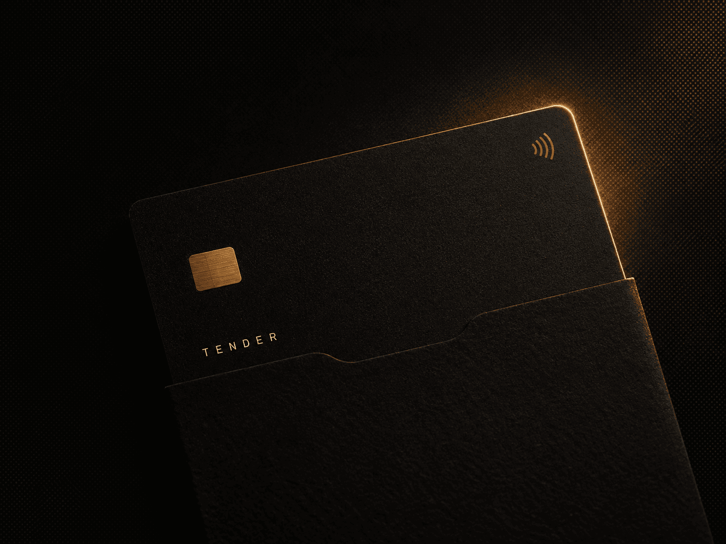 The Tender card, matte black with an ochre edge, half out of its sleeve